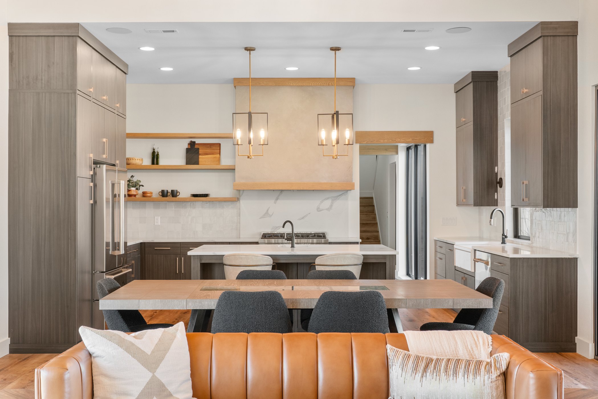 Designer kitchen with warm cabinetry and premium finishes