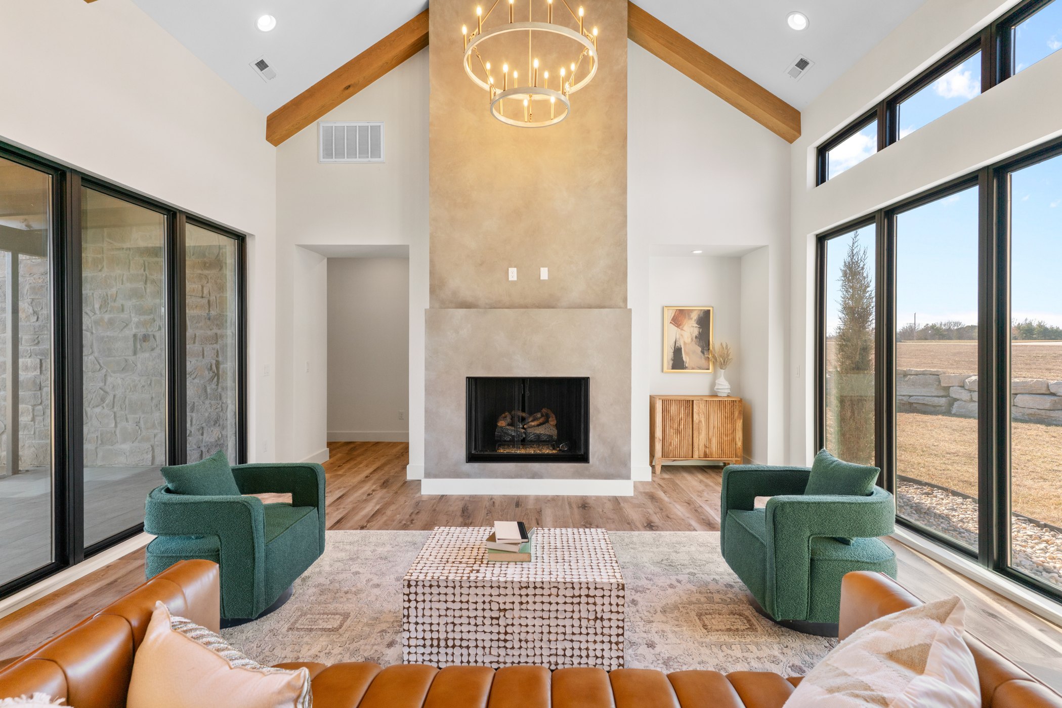 Luxury living room with fireplace and large windows