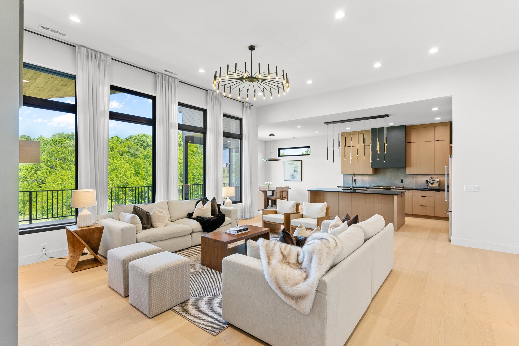Luxury open-concept living room photographed by Frame and Focus
